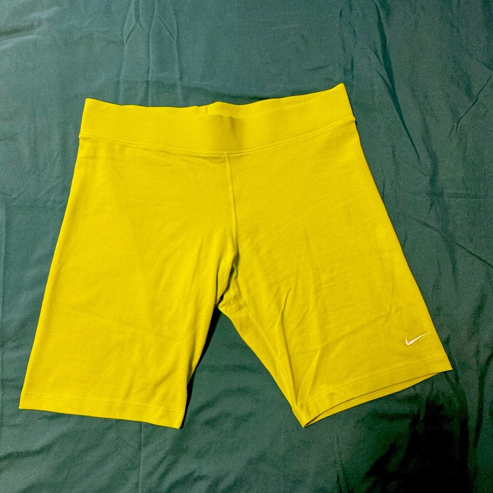 "Neon green Nike athletic shorts with a fitted design"